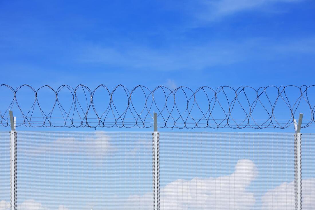  a chainlink fence with spike wire